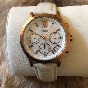 vintage collection of a watch by the brand Titus,in rose gold